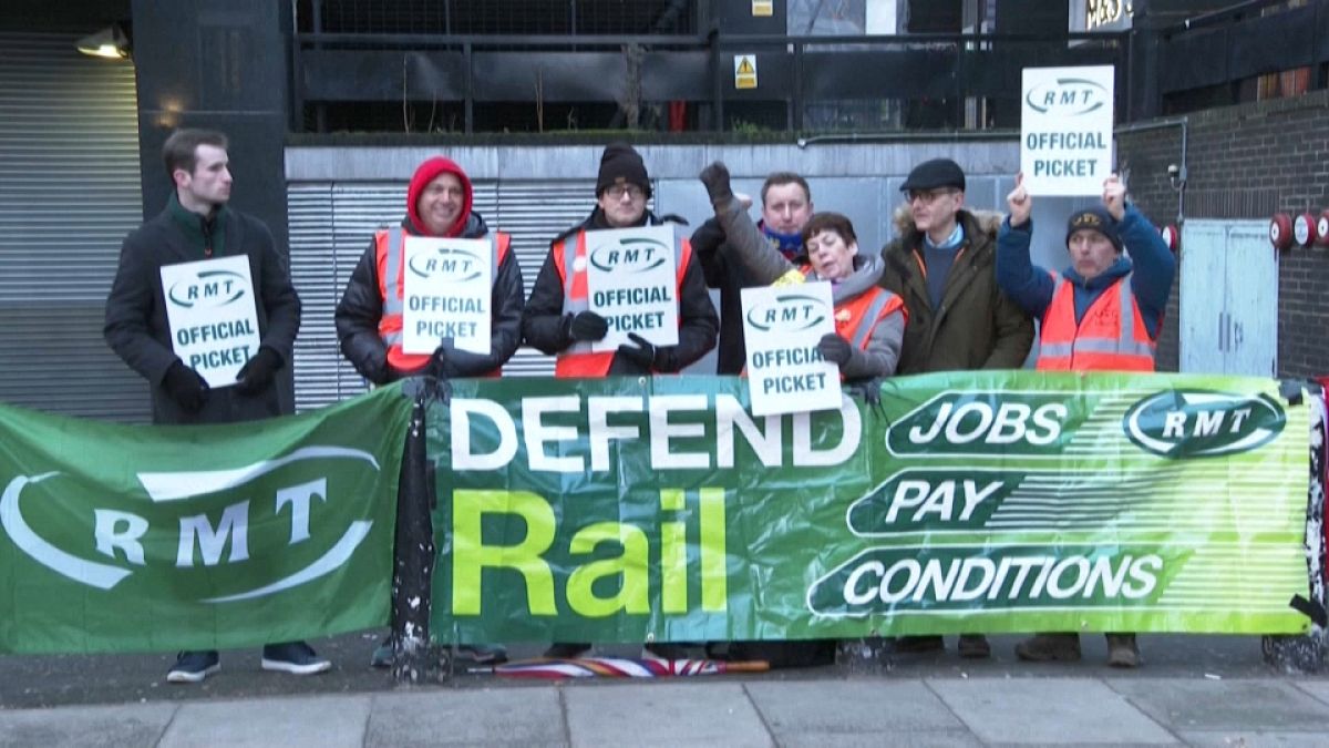 Members of the RMT union on a picket line outside Euston Station in London