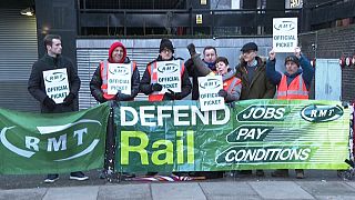 Members of the RMT union on a picket line outside Euston Station in London