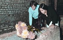Olivia Hussey and Leonard Whiting, stars of Franco Zeffirelli's "Romeo and Juliet" place flowers on the Tomb of Juliet in Verona in 1968