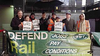 Mick Lynch, second right, general secretary of the Rail, Maritime and Transport union (RMT) joins members on the picket line outside Euston train station in London, 04/01/2023