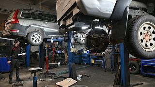 A mechanic works on cars in a auto repairing shop in Ukrainian capital of Kyiv.