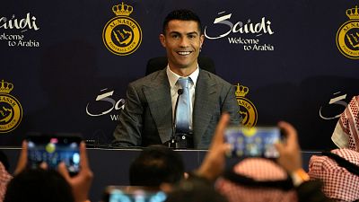 Cristiano Ronaldo smiles during a press conference for his official unveiling as a new member of Al Nassr soccer club in in Riyadh, Saudi Arabia, Tuesday January 3rd.