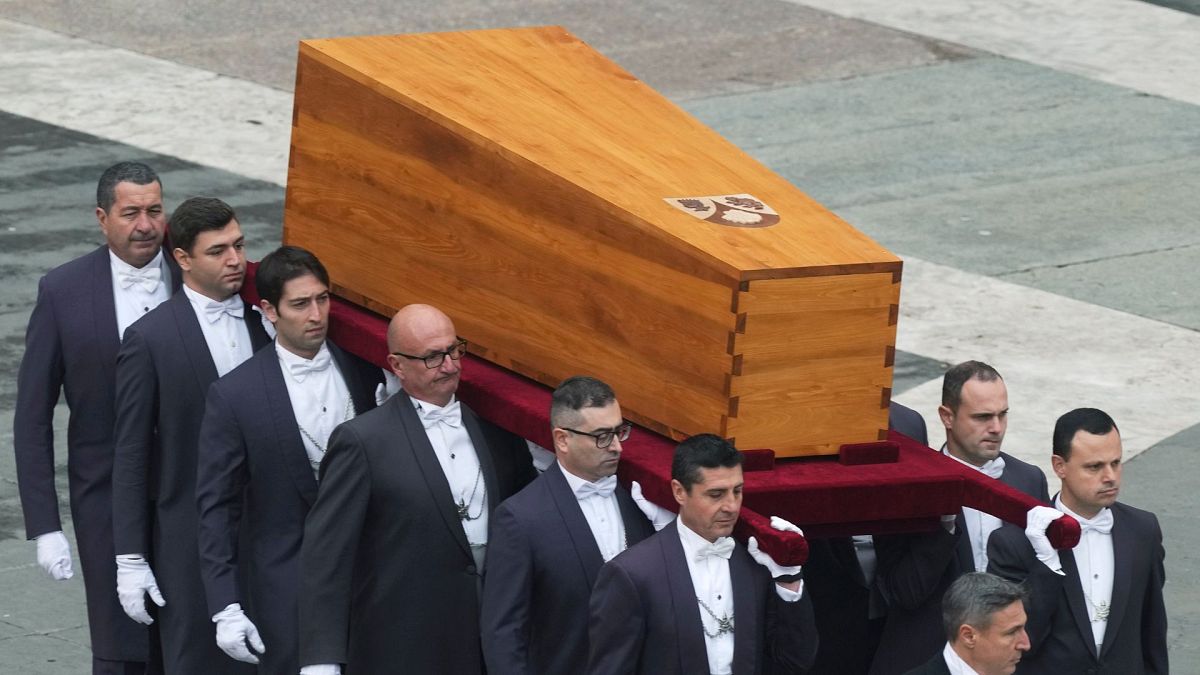 The coffin of late Pope Emeritus Benedict XVI is brought to St. Peter's Square for a funeral mass at the Vatican, Thursday, Jan. 5, 2023.
