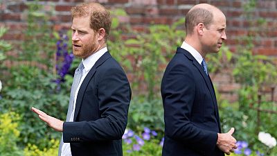 FILE - FILE - Prince Harry, left, and Prince William stand together during the unveiling of a statue they commissioned of their mother Princess Diana, July 2021