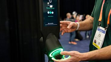 An exhibitor demonstrates the OneThird avocado ripeness checker during CES Unveiled
