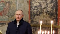 الرئيس الروسي فلاديمير بوتين لدى حضوره قداس عيد الميلاد للكنيسة الأرثوذكسية في الكرملين بموسكو يوم الأحد. 