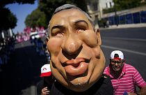 Protestors push an effigy of Portuguese Prime Minister Antonio Costa towards the parliament during a demonstration by workers' unions in Lisbon, July 2022.