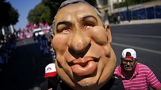 Protestors push an effigy of Portuguese Prime Minister Antonio Costa towards the parliament during a demonstration by workers' unions in Lisbon, July 2022.