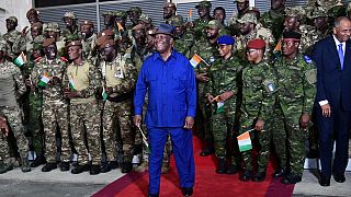Pardoned Ivorian soldiers return home 