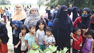 Rohingya refugees gather after they arrived on Lamnga beach in Aceh province, Indonesia, Sunday, Jan. 8, 2023. 