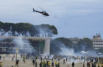 Protesters, supporters of Brazil's former President Jair Bolsonaro, clash with police as they storm the Planalto Palace in Brasilia, Brazil. Sunday, 8 January 2023.