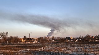 Smoke rises after shelling in Soledar, the site of heavy battles with Russian forces in the Donetsk region, Ukraine