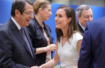 Cypriot President Nicos Anastasiades, left, greets Finland's Prime Minister Sanna Marin at an EU summit in Brussels, June 24, 2022.
