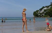 Tourists enjoy at Kamala beach in Phuket, Thailand. 