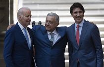 Mexican President Andres Manuel Lopez Obrador embraces President Joe Biden and Canada Prime Minister Justin Trudeau at the North American Leaders' Summit.