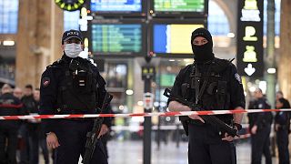 French police stand guard in a cordonned off area at Paris' Gare du Nord train station, 11 January 2023
