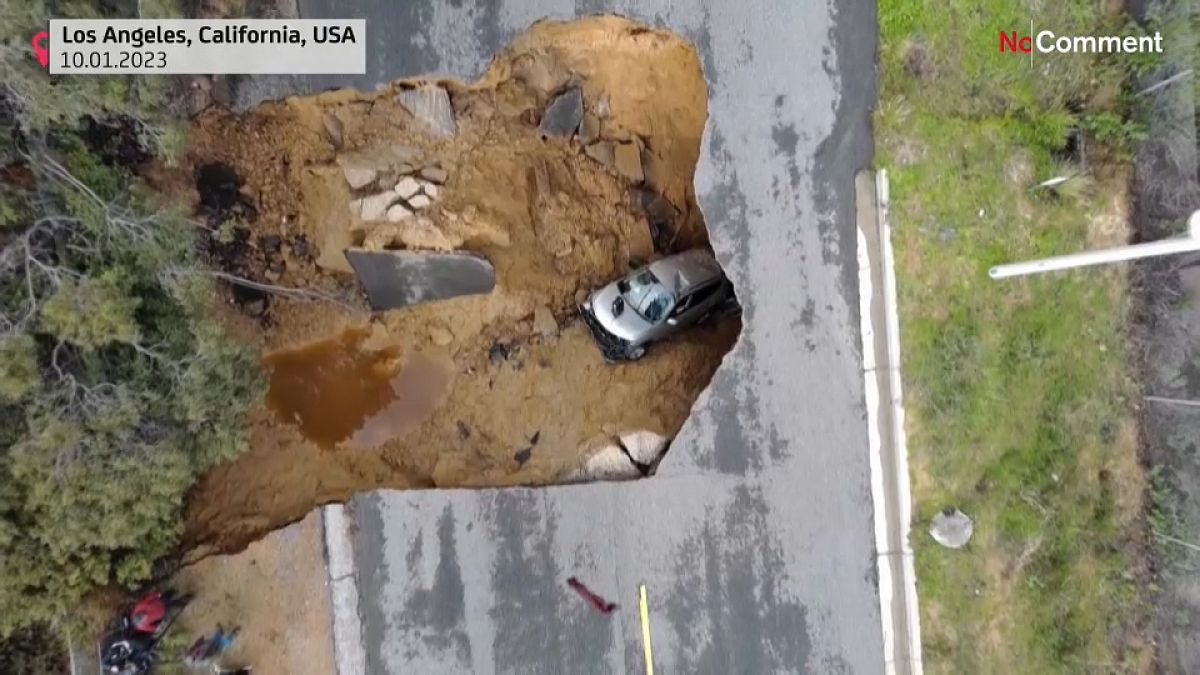 Cars in a California sinkhole caused by flooding
