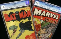 Batman #1, left, and Marvel Mystery Comics #9 are shown at Heritage Auction Galleries, in Dallas. 