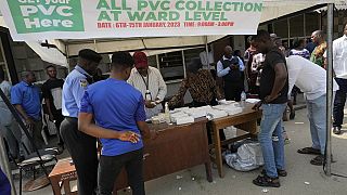Nigerians rush to collect voter cards with election weeks away