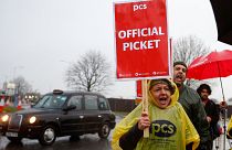Members of the Public and Commercial Services (PCS) Union take part in a border force workers strike action near Heathrow Airport.