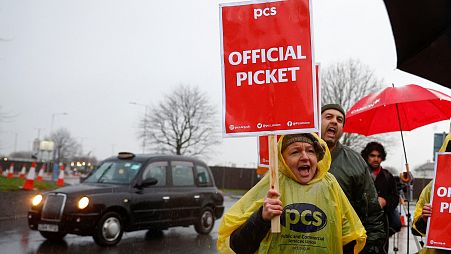 Members of the Public and Commercial Services (PCS) Union take part in a border force workers strike action near Heathrow Airport.