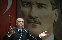 Turkey's President Recep Tayyip Erdogan, gestures as he delivers a speech in Ankara, Friday, March 30, 2018. 