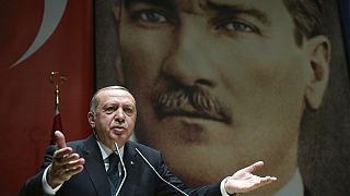 Turkey's President Recep Tayyip Erdogan, gestures as he delivers a speech in Ankara, Friday, March 30, 2018. 