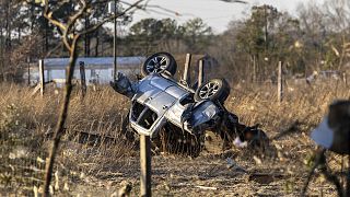 An SUV is overturned near 1349 County Road 43 in the aftermath from severe weather. Thursday, 12 January 2023, in Prattville, Alabama.