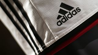 The Adidas logo on a pair of shorts