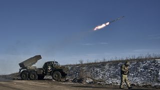 A Ukrainian army Grad multiple rocket launcher fires rockets at Russian positions on the frontline near Soledar, 11 January 2023