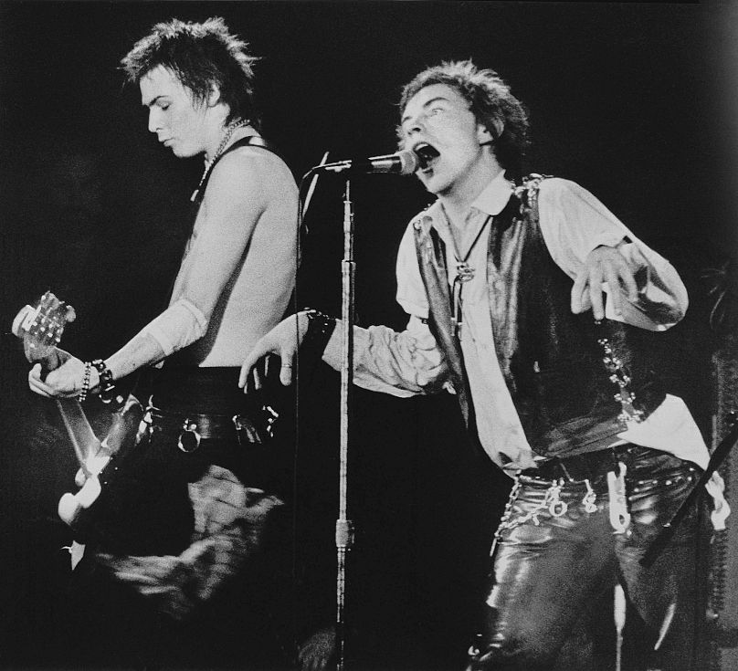 Sid Vicious, left, on bass guitar and frontman John Rotten of the Sex Pistols perform in front of a capacity crowd at San Francisco's Winterland auditorium, Jan. 15, 1978.