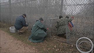 Workers are constantly repairing the damaged fence