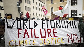 People attend a climate protest rally by Swiss party Juso and Strike WEF on the eve of the 52nd annual meeting of the World Economic Forum in Davos.