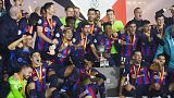 A dominant Barcelona side took advantage of three costly errors to beat bitter rivals Real Madrid by three goals to one and clinch the Spanish Super Cup
