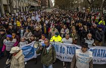 People gather during a protest in support of public health care in Madrid, Spain. Sunday, 15 January 2023.