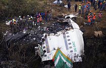 Rescuers scour the crash site in the wreckage of a passenger plane in Pokhara, Nepal, Monday, Jan.16, 2023.