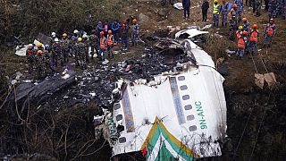 Rescuers scour the crash site in the wreckage of a passenger plane in Pokhara, Nepal, Monday, Jan.16, 2023.