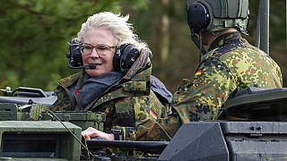 Christine Lambrecht, Minister of Defence, rides in a tank during her visit to the Tank Training Brigade 9 in Munster, Germany, Feb. 7, 2022.