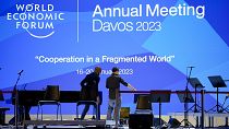 People set up the stage at the eve of the opening of the World Economic Forum in Davos, Switzerland, Sunday, January 15, 2023. 