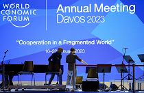 People set up the stage at the eve of the opening of the World Economic Forum in Davos, Switzerland, Sunday, January 15, 2023. 