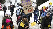 eople attend a climate protest rally by Swiss party 'Juso' and the organization 'Strike WEF' on the eve of the 52nd annual meeting of the World Economic Forum (WEF) in Davos, 