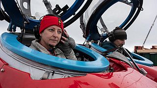 Dr Susanne Lockhart and John Hocevar prepare for a dive off Half Moon Island, Antarctica.