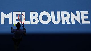 Katherine Sebov of Canada walks to serve to Caroline Garcia of France during their first round match at the Australian Open in Melbourne, 17 January 2023