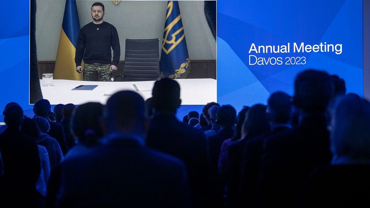 President Zelenskyy stands to observe a minute's silence at the WEF forum in Davos