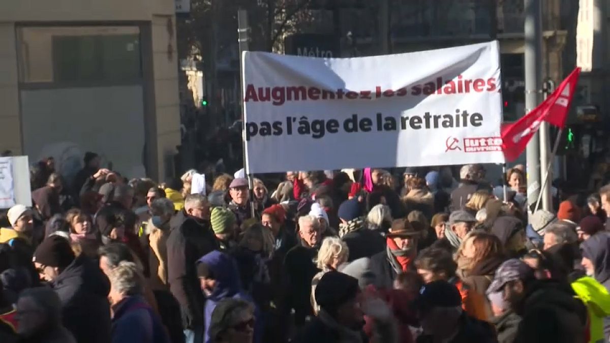 Demonstrators gather in Paris, Marseille and other cities as strikes severely disrupt transport and schools.