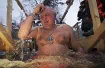 A Russian Orthodox worshipper dips into the icy water during a traditional Epiphany celebration in St. Petersburg, Russia.
