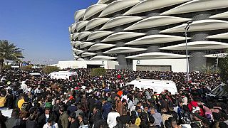 Footballs fans in Iraq try to enter the Basra International Stadium for the Gulf Cup final. 