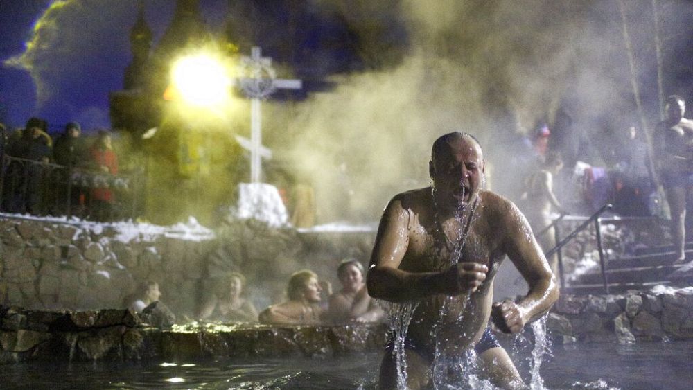 Watch: Ukrainians and Russians mark Epiphany as fierce fighting rages on