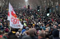 Protesters march during a demonstration against pension changes in Paris. Workers in many French cities took to the streets Thursday to reject proposed pension changes.