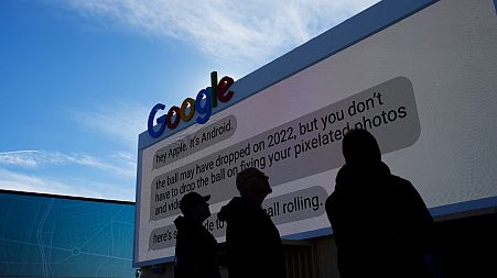 A person walks by the Google booth at the Las Vegas Convention Center before the start of the CES tech show, Monday, Jan. 2, 2023, in Las Vegas., USA.